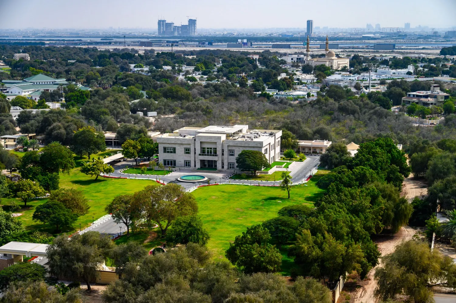 Aerial view of a green, low-rise residential district in the UAE